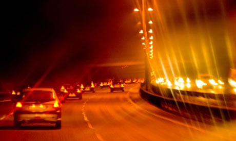 Traffic at night on a British motorway.