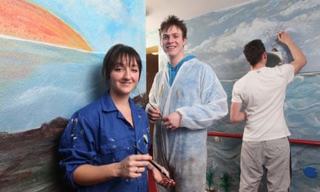 Social work students helping kids paint a care home in their own style