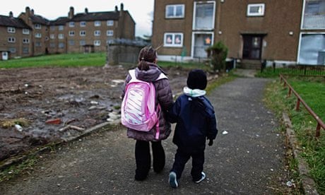 Two children on deprived housing estate