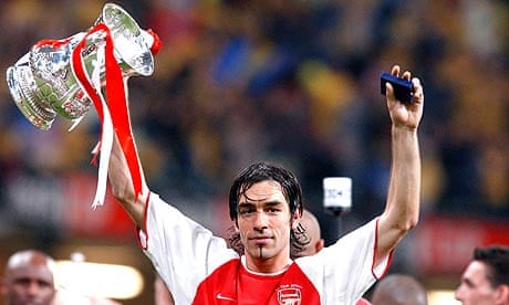 Robert Pires, who is close to joining Aston Villa, celebrates winning the 2003 FA Cup with Arsenal