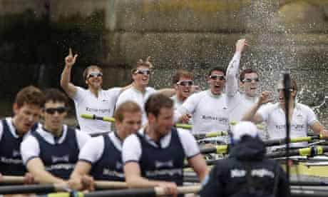 Members of the Cambridge University crew celebrate winning the 156th annual Boat Race