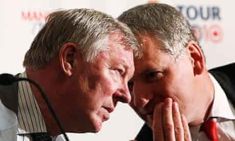Sir Alex Ferguson, left, speaks with David Gill at a press conference at New York