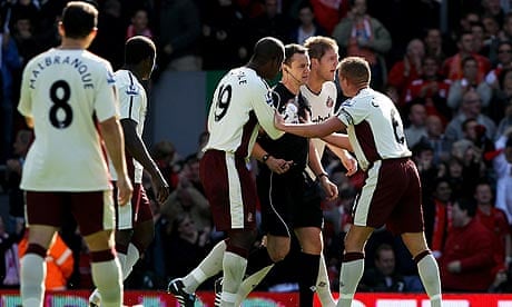 Sunderland players surround Stuart Attwell after he allowed Liverpool's opening goal to stand