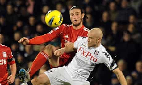 Liverpool's Andy Carroll with Philippe Senderos of Fulham