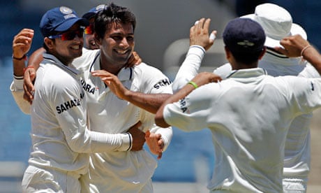 Praveen Kumar is congratulated by his India team-mates