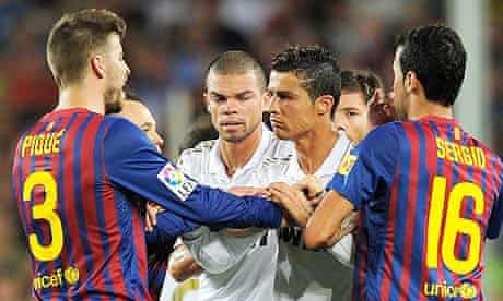 Gerard Pique argues with Real Madrid players