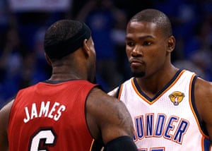 NBA1: Miami Heat's James bumps chests with Oklahoma City Thunder's Durant
