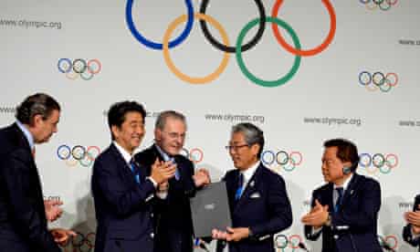 Members of Tokyo's bid committee attend a signing ceremony after the city was awarded the 2020 Games