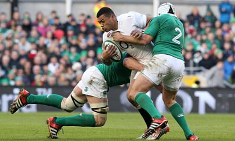 Luther Burrell of England is tackled by Ireland's Paul O'Connell and Rory Best in the Six Nations