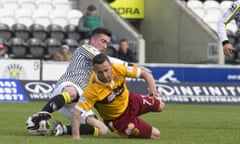 Stevie Mallan, left, tackles Motherwell's Scott McDonald in the Scottish Premiership