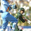 Yasir Hameed places a shot past Indian wicketkeeper Rahul Dravid