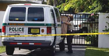A police investigator outside Sean Taylor's home in Miami