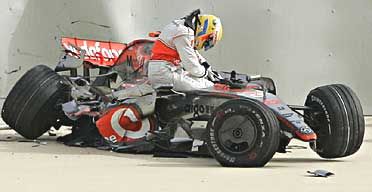 mclaren bahrain hopes skids puts 125mph emerges crashing tyre walls