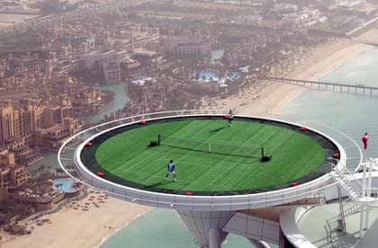 Andre Agassi and Roger Federer play on the world's most unique tennis court, the Burj Al Arab hotel's helipad, Dubai
