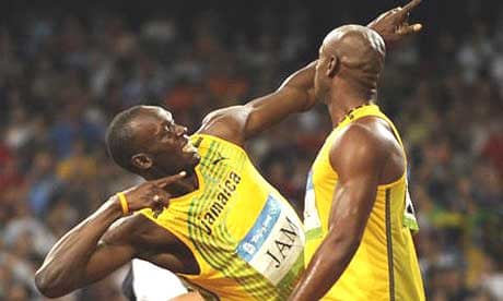 Usain Bolt and Asafa Powell celebrate