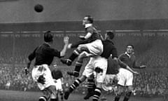 Hughie Gallacher, the Chelsea and Scotland forward, wins a duel for the ball against Arsenal