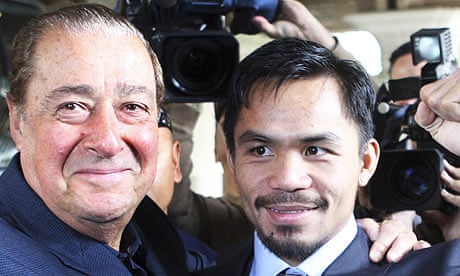 Manny Pacquiao poses with boxing promoter Bob Arum
