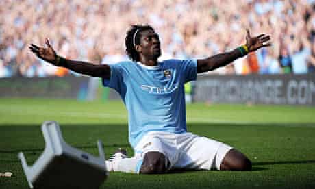 Emmanuel Adebayor celebrates in front of Arsenal supporters after scoring for Manchester City