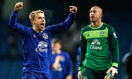 Phil Neville, left, and Tim Howard celebrate Everton's win at Manchester City last Monday