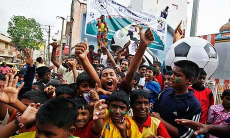 Football fans in Bangalore, Indian, celebrate the start of the World Cup 2010