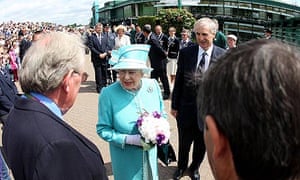 The Queen meets head groundsman Eddie Seaward after arriving at Wimbledon