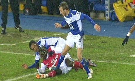 TV images appear to show Lee Bowyer, right, stamping on Bacary Sagna's knee