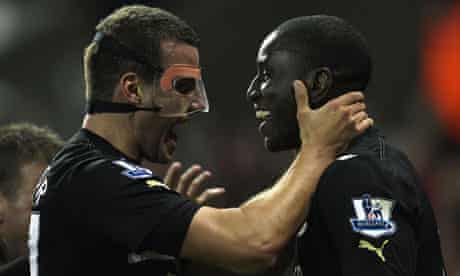 Steven Taylor, left, congratulates the Newcastle goalscorer Demba Ba