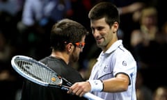 Janko Tipsarevic, left, is congratulated by Novak Djokovic at the O2 Arena