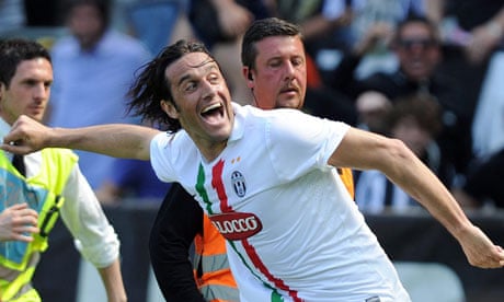 Luca Toni celebrates his winner against Genoa
