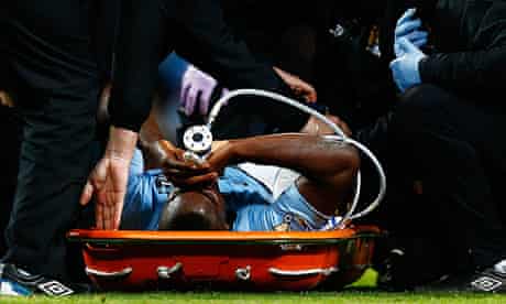 Micah Richards recieves oxygen after tearing a cartilage in Manchester City's 1-0 win over Swansea