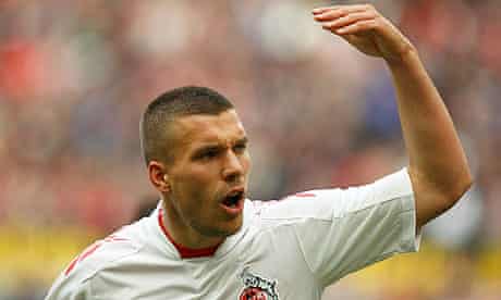 Cologne's Podolski gestures during their German Bundesliga soccer match against Stuttgart in Cologne