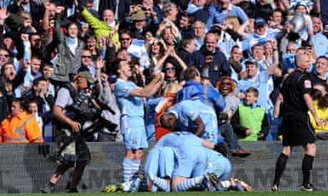 Manchester City players celebrate Sergio Agüero's Premier League title winning goal.