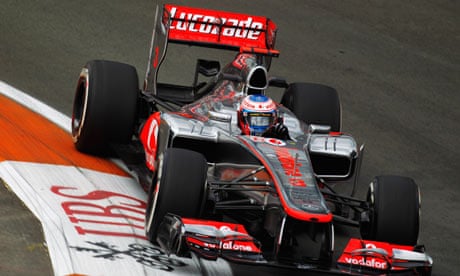 Jenson Button takes to the track in a Lewis Hamilton replica