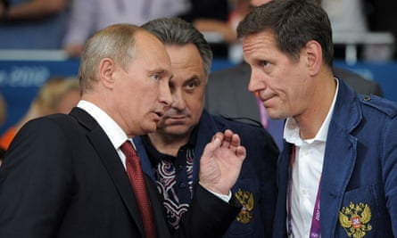 Vitaly Mutko, centre, with Russian president Vladimir Putin