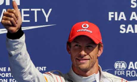 Jenson Button of McLaren shows his pleasure at claiming pole position for the Belgian F1 Grand Prix