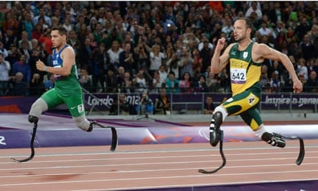 Alan Oliveira, left, of Brazil and Oscar Pistorius of South Africa in the men's T43/44 200m final