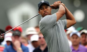 Tiger Woods tees off