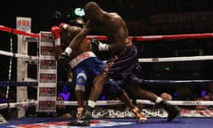 Deontay Wilder, right, knocks Audley Harrison down to win the fight at Motorpoint Arena, Sheffield.