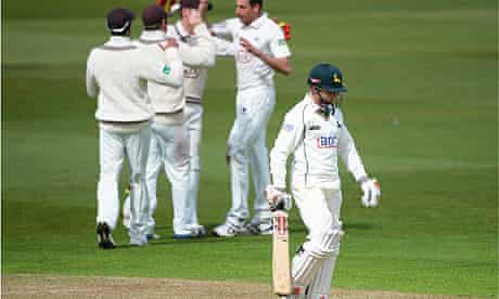 James Taylor trudges off and Surrey players celebrate after the Nottinghamshire batsman was dismisse