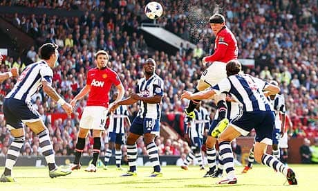 Manchester United's Wayne Rooney heads at goal against West Bromwich Albion in the Premier League 