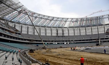 Men working inside the National Stadium in Baku.