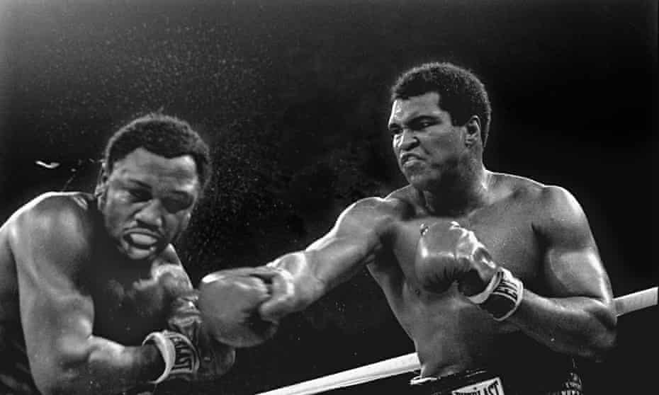 Muhammad Ali, right, stuns Joe Frazier in the ninth round of theirfight in Manila on 1 October 1975