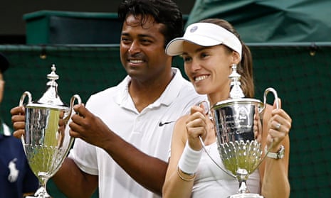 Martina Hingis, right, celebrates her second Wimbledon title in two days with Leander Paes.