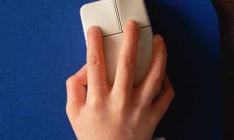 Boy's hand using computer mouse