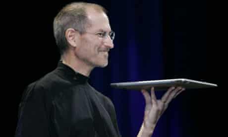 Apple CEO Steve Jobs shows off the MacBook Air