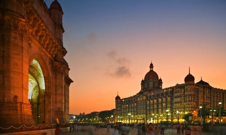 Colaba nightlife scene with restaurants and evening crowds near Gateway of India