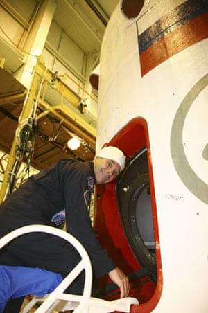 Soyuz spacecraft: Guy Laliberte gets into the Soyuz spacecraft at the Baikonur Cosmodrome