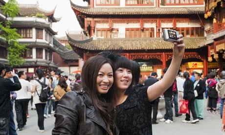 Tourists taking their own photograph at Yu Yuan Garden, Huangpu District, Shanghai, China