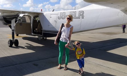 Isabel and son Ossian with the eight-seater plane that took them from Antigua to Barbuda