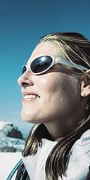 Glamorous skier in sunglasses